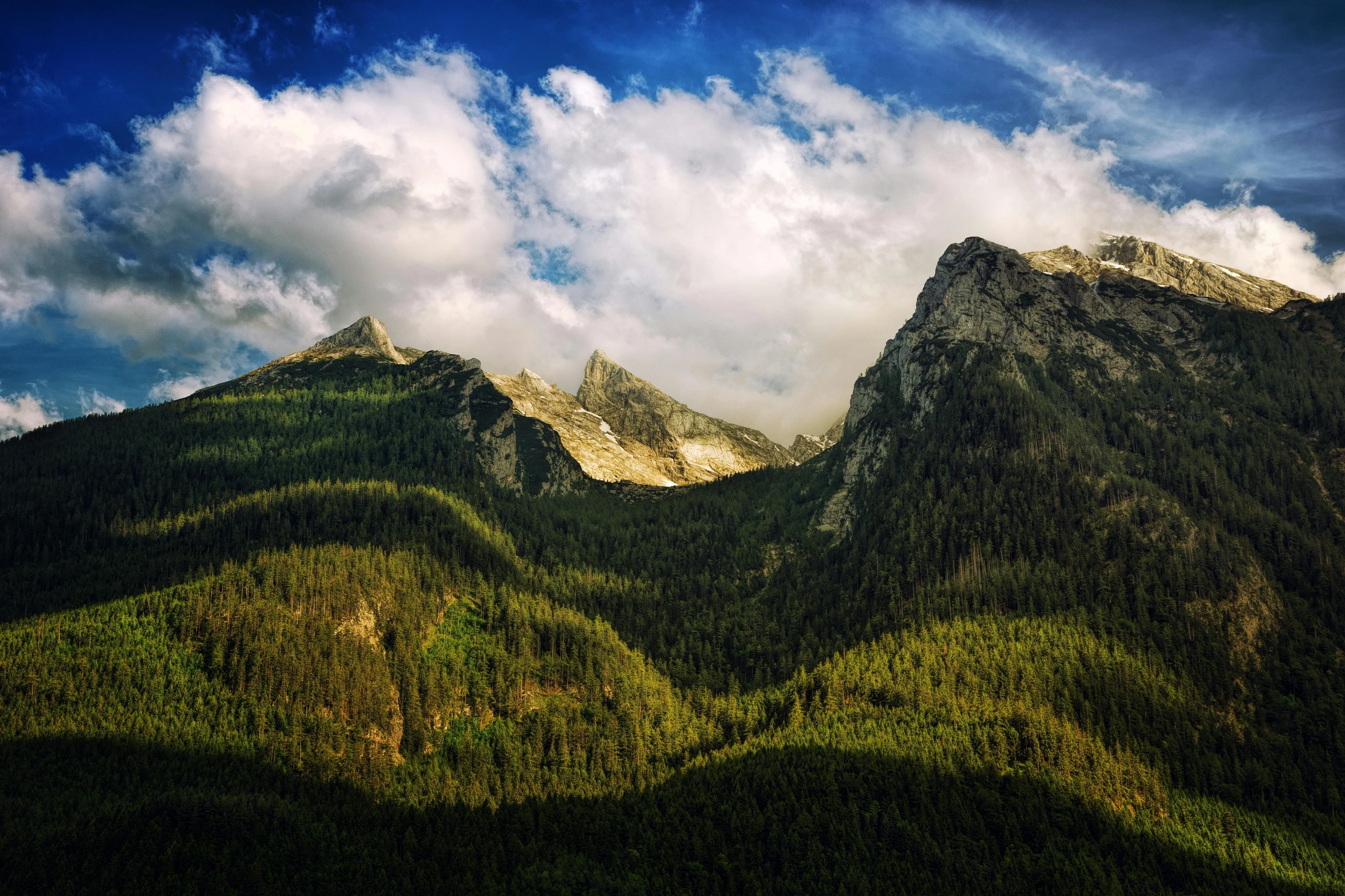 a mountain range that has a couple of peaks sticking out