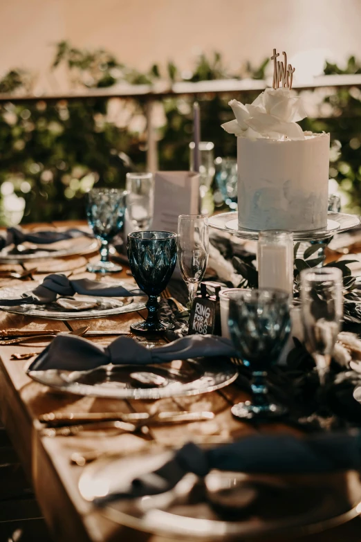 a wedding cake sits on top of a wooden table