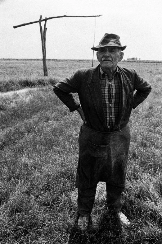 a man standing in the middle of a field