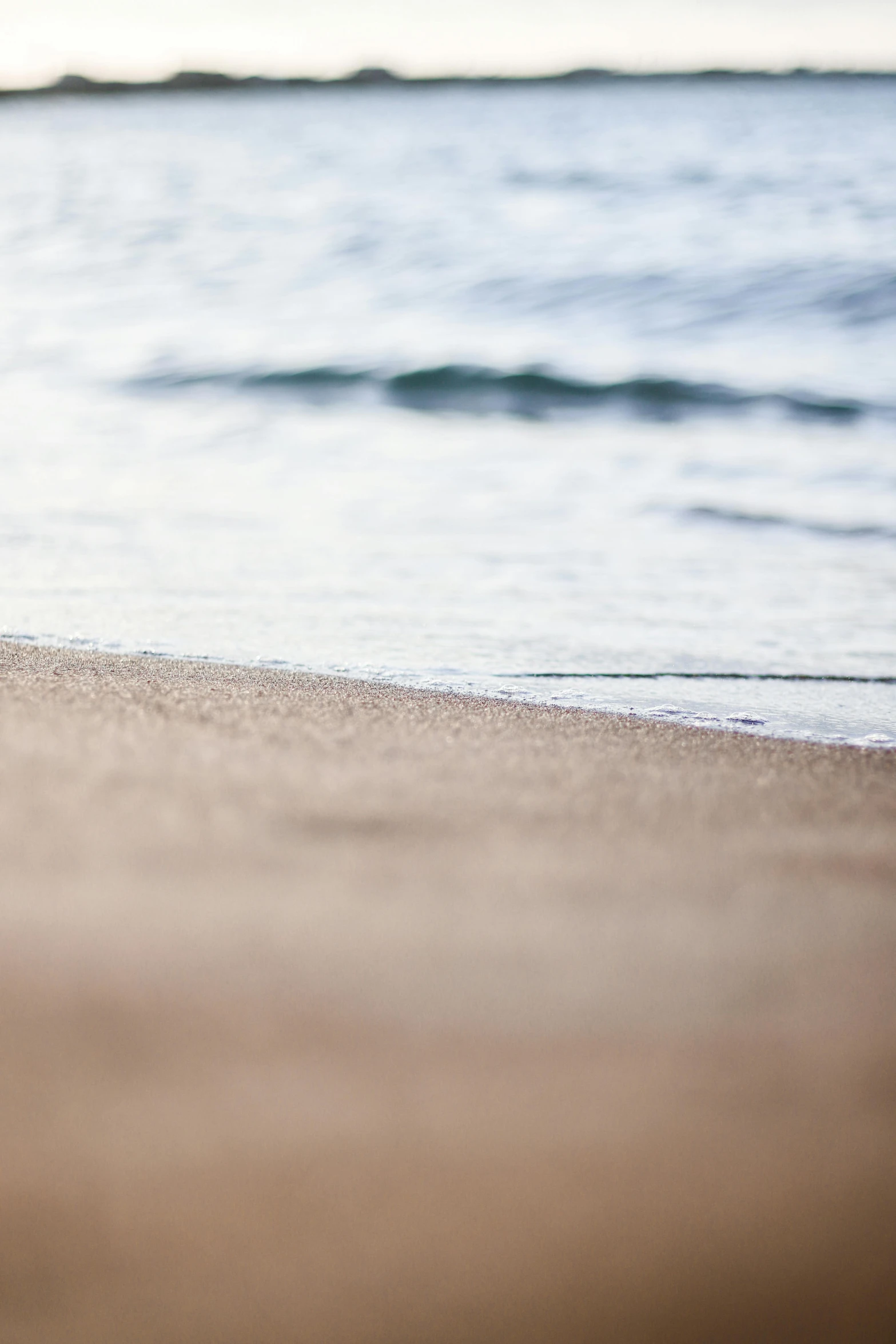 an orange and white object laying on the beach