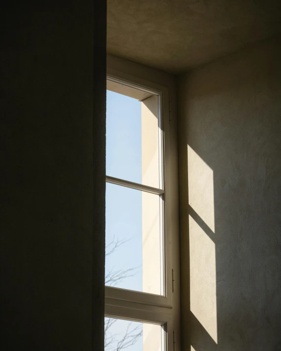 a picture of a wall and window in a house