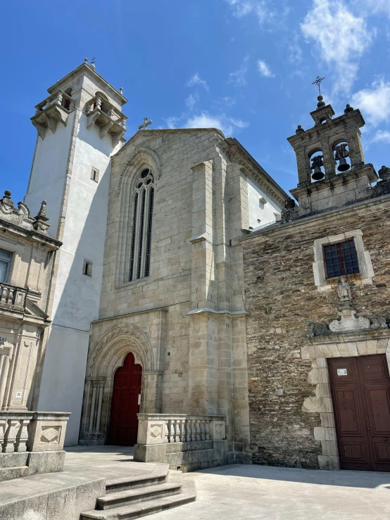 an old church with two tall towers on top