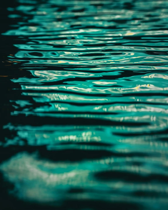 blue water and rain drops on top with black background