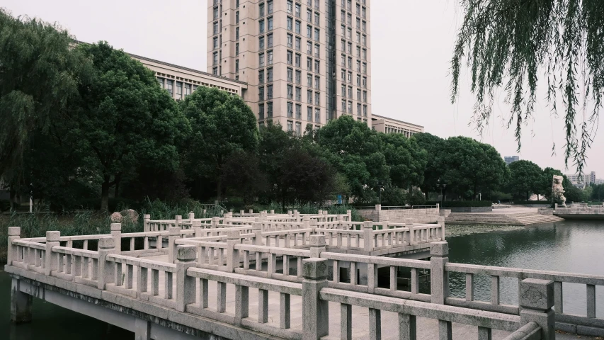 there is some concrete bridges going across a lake