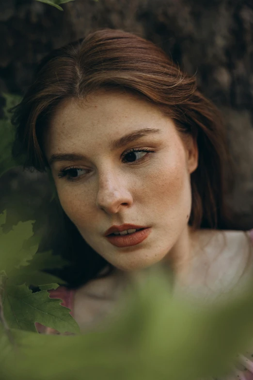 a girl with blue eyes stares into the camera