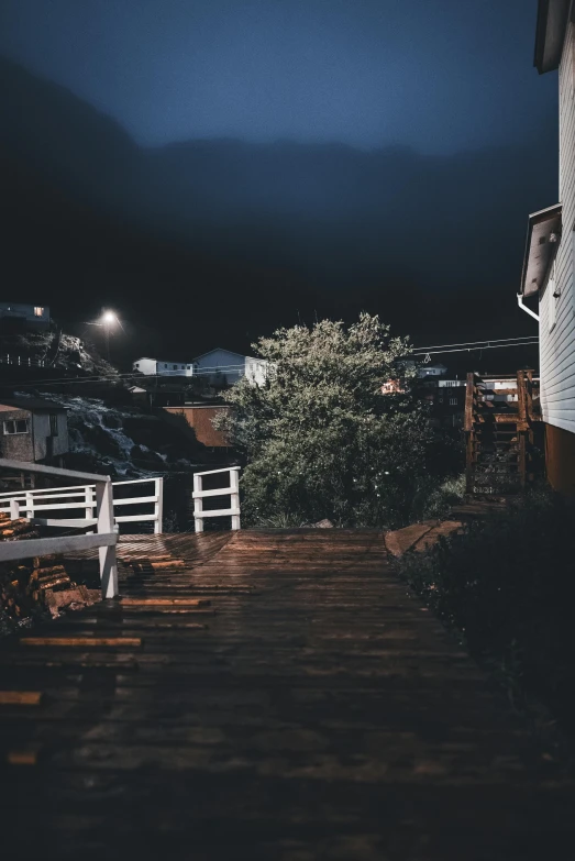 some steps near a fence at night in the dark