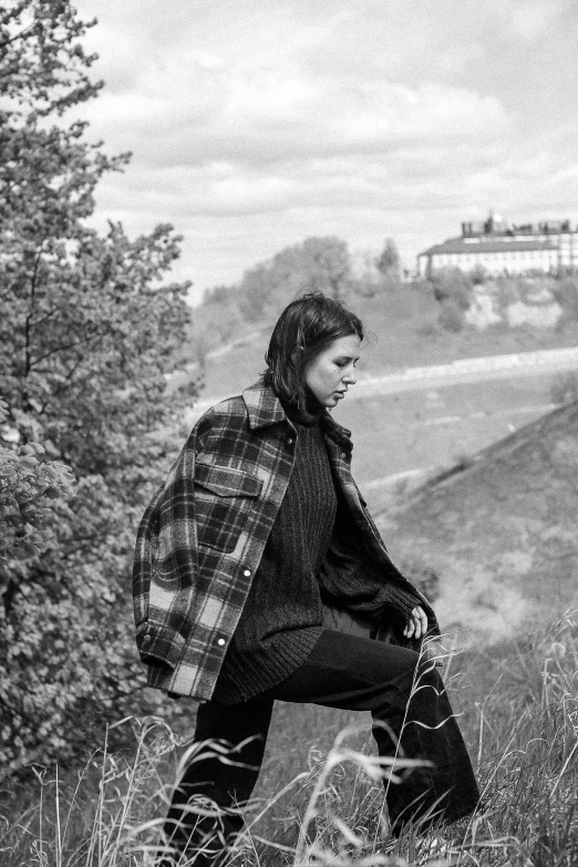 black and white pograph of a woman in a coat