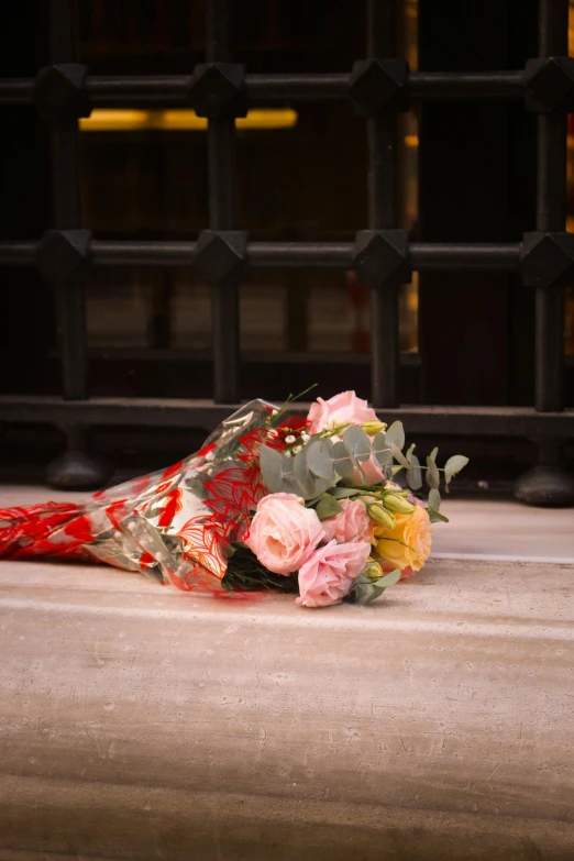 a bouquet of flowers that is laying on the ground