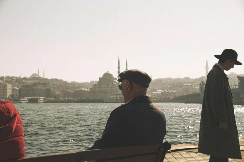 a man is looking out at the water