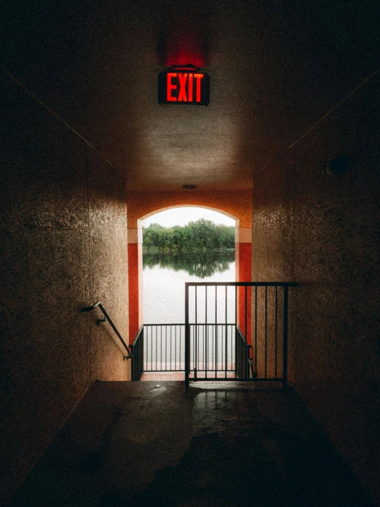 this is an exit sign with water behind it