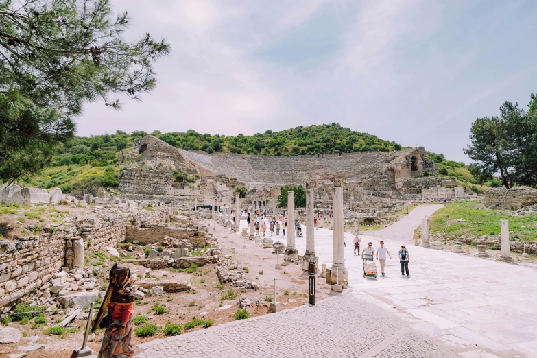 people walking around in an ancient village