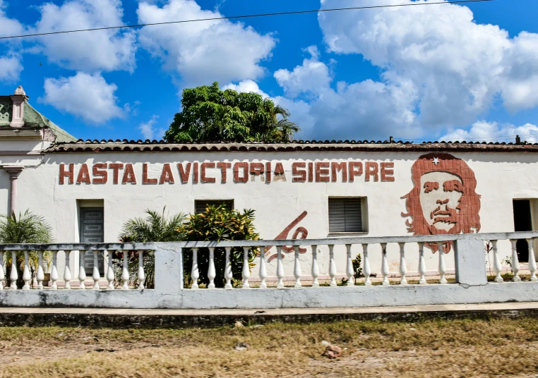 a small building with a large sign on it