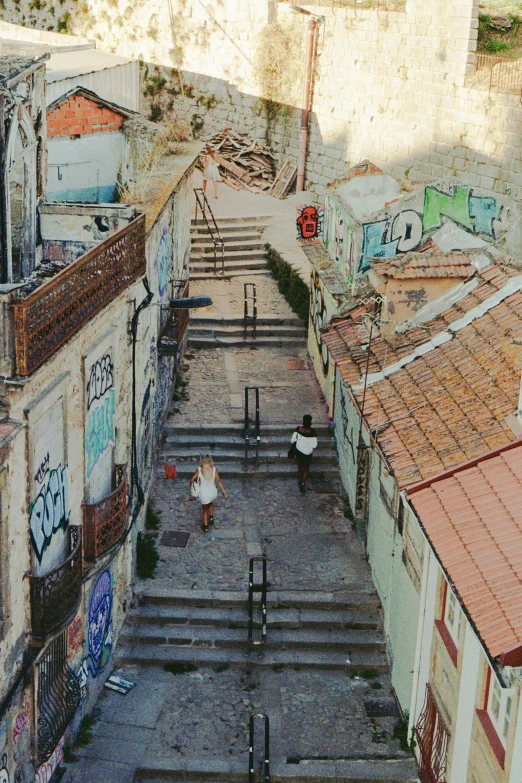 a stone stairway and staircase leading to some buildings