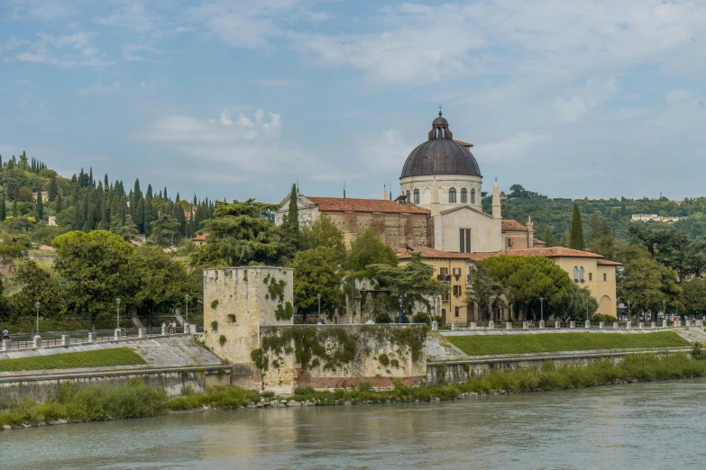 a church on the edge of a body of water