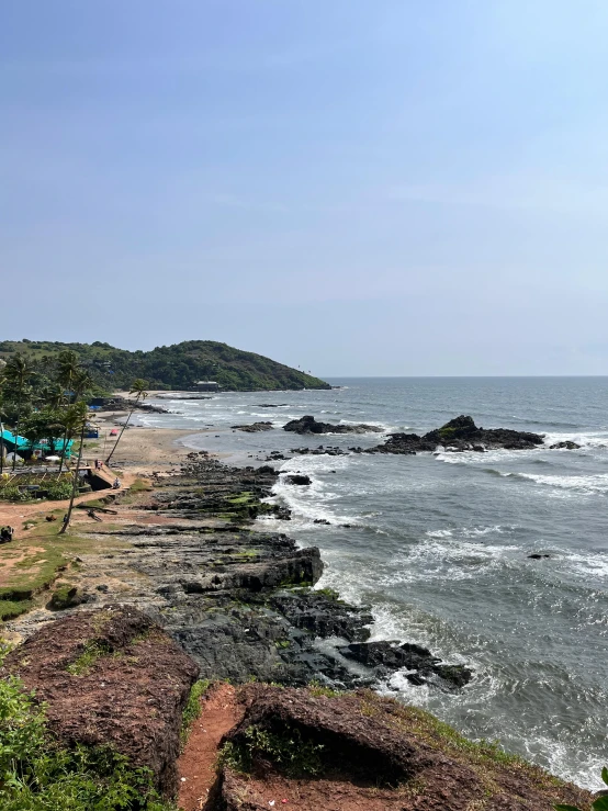 there is a beach with waves coming in