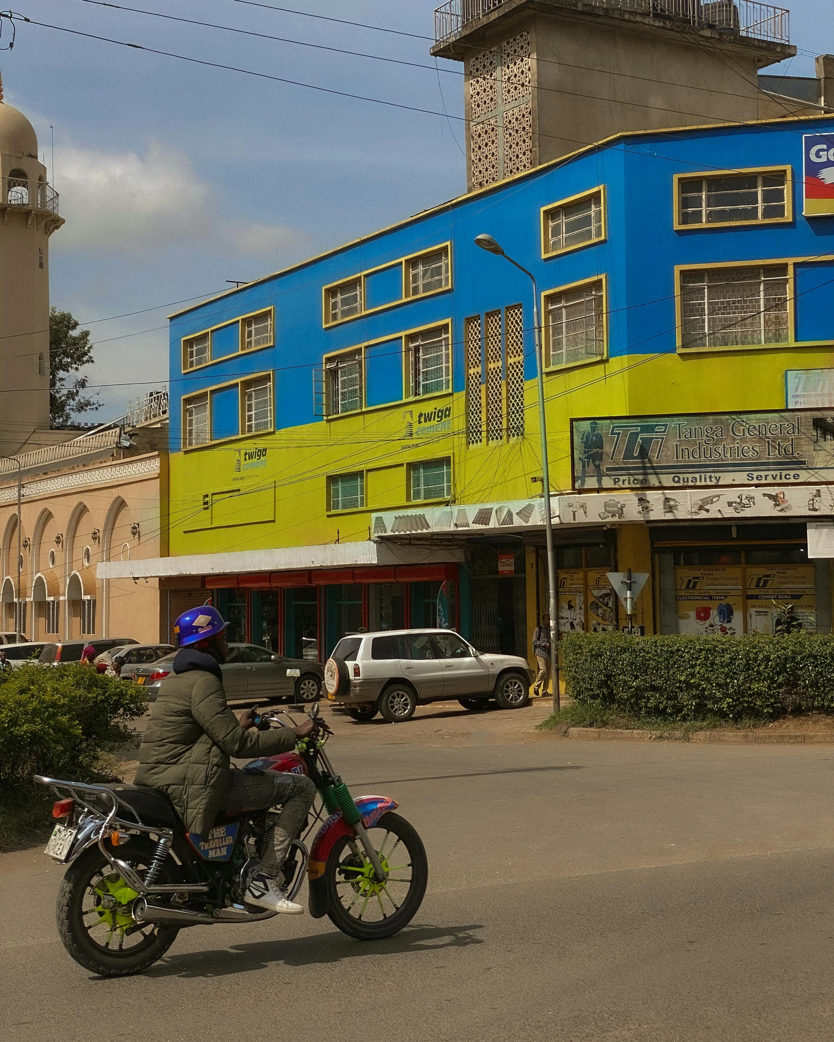 a man on a motorcycle on a city street