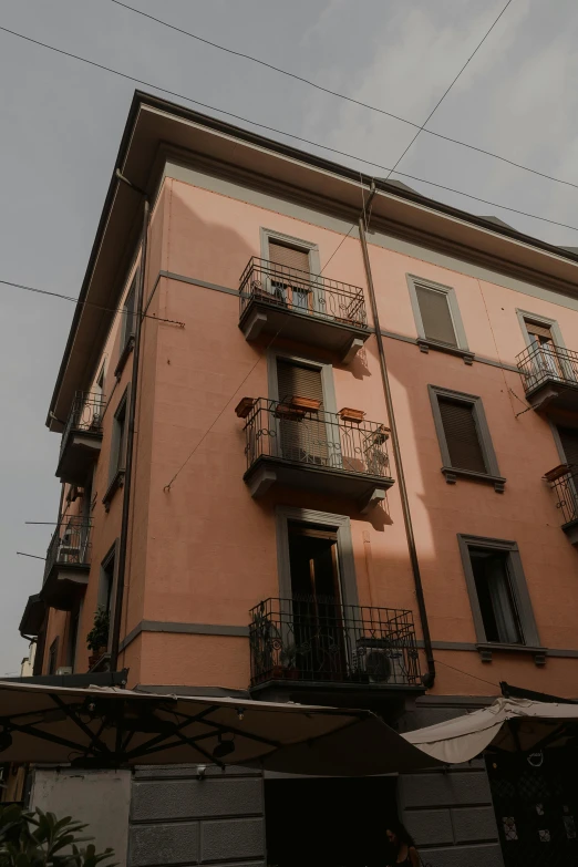 a building with balconies and balconies attached to the second story