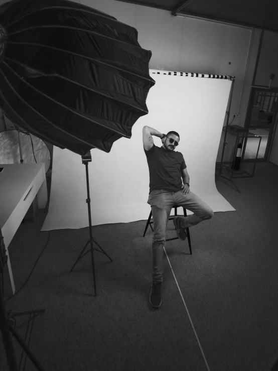 a man is kneeling down next to a camera