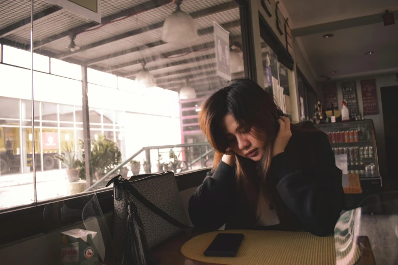 the young woman is having an enjoyable conversation on the phone