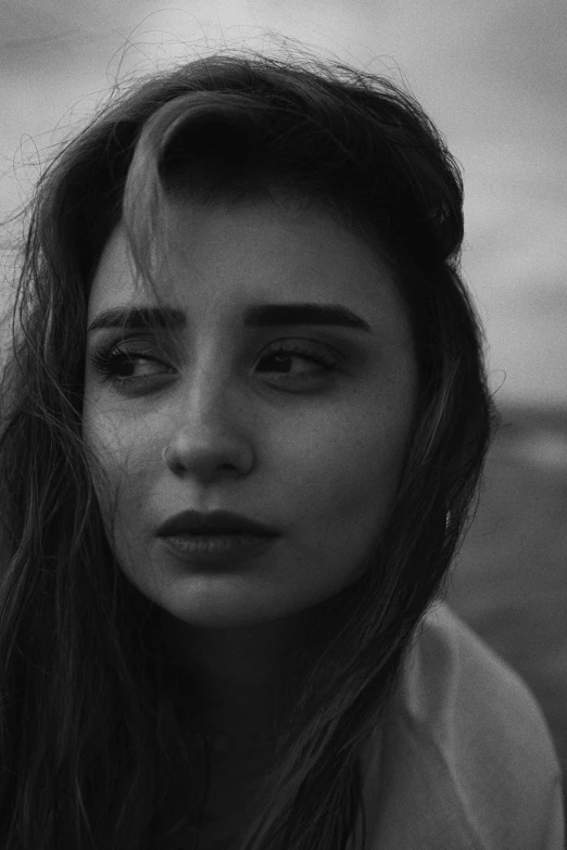 a black and white po of a woman with long hair