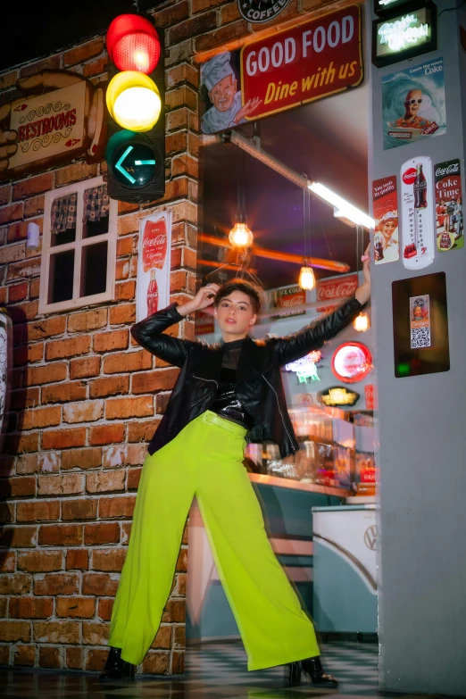 a woman is dancing outside of a restaurant