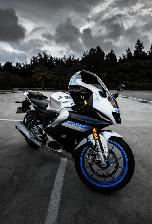 a motorcycle that is sitting in the middle of a parking lot