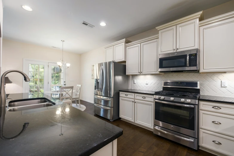 a kitchen filled with a stove and refrigerator