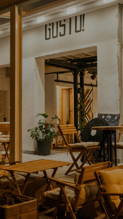 a restaurant with several chairs in front of it