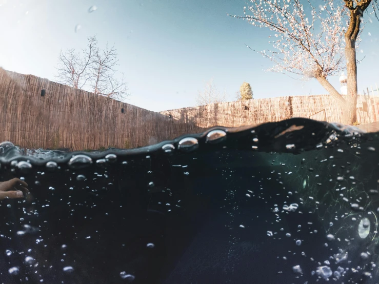 water bubbles from the surface of a swimming pool