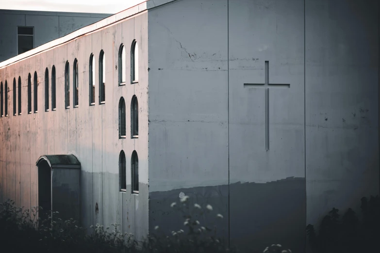 an old church with a cross on the wall