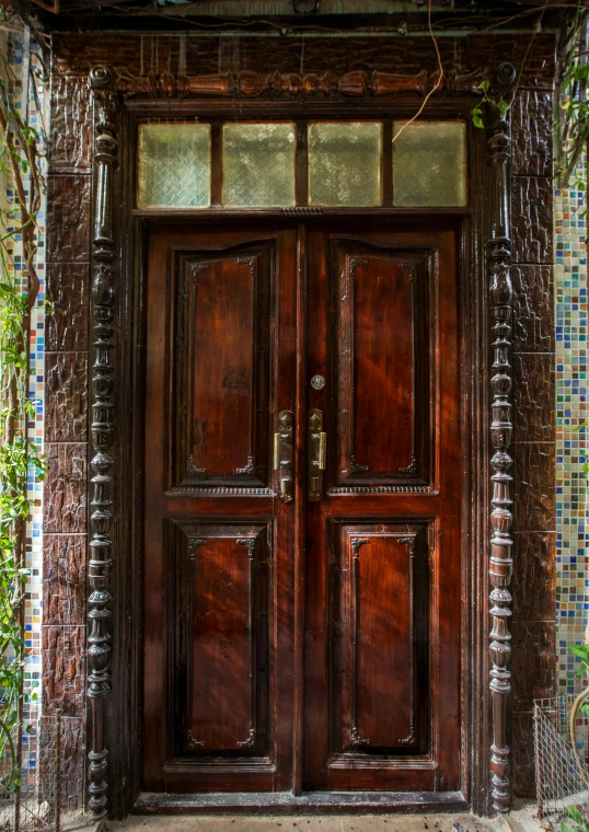 a wooden door with glass on top