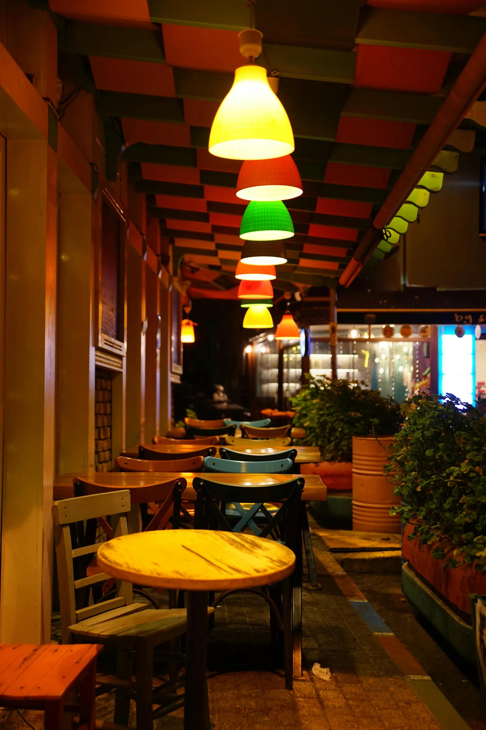 the inside of an empty restaurant with lots of chairs and tables