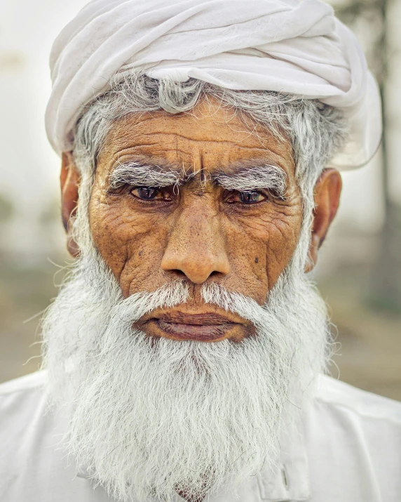 an old man with white hair and a long white beard