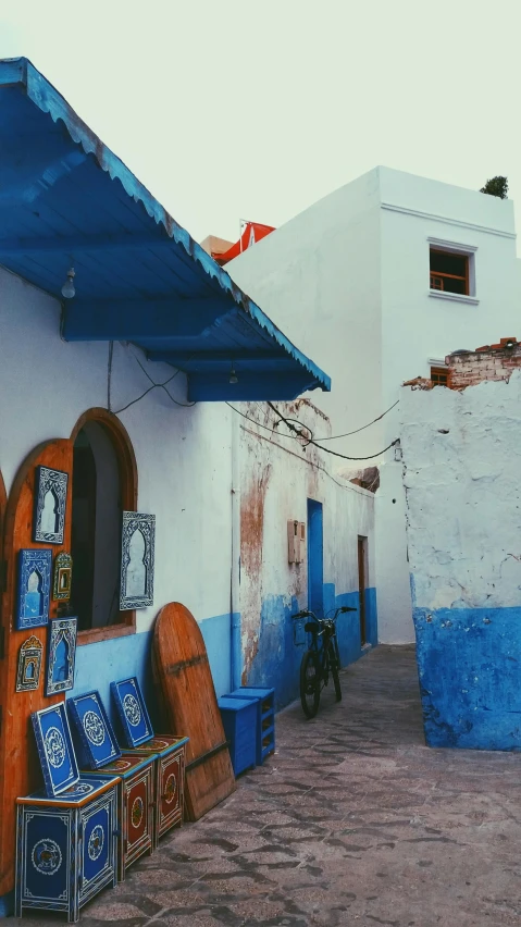 blue and white colored furniture outside of a building