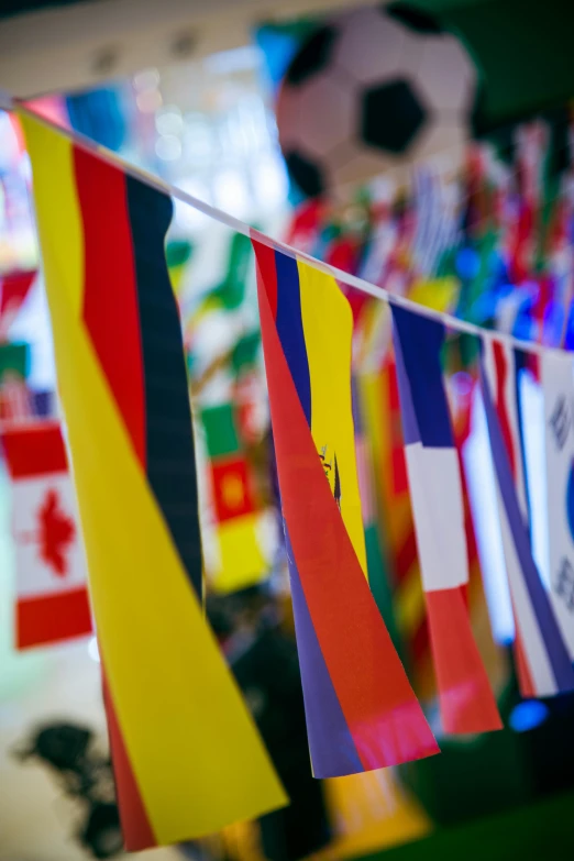 a line of small flags hanging from a rope