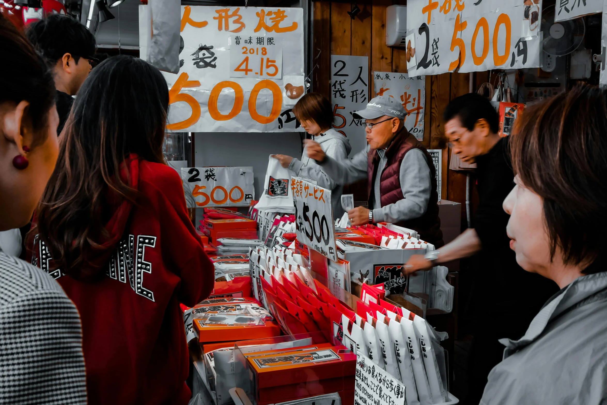 a woman looking at merchandise in a store