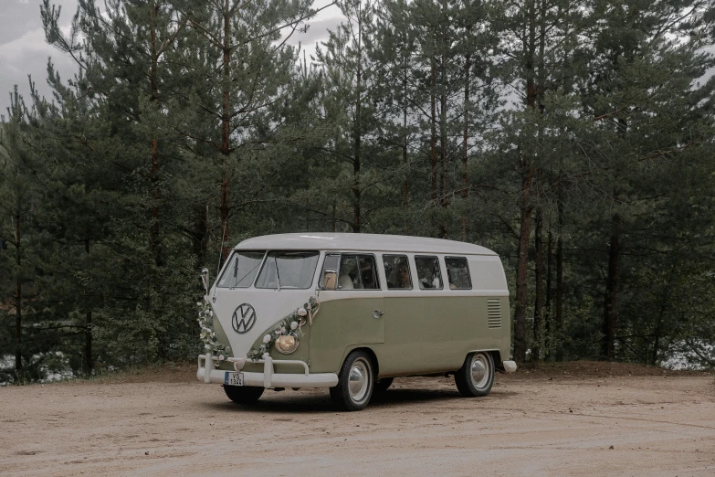 a small green bus with the words vw on the front of it