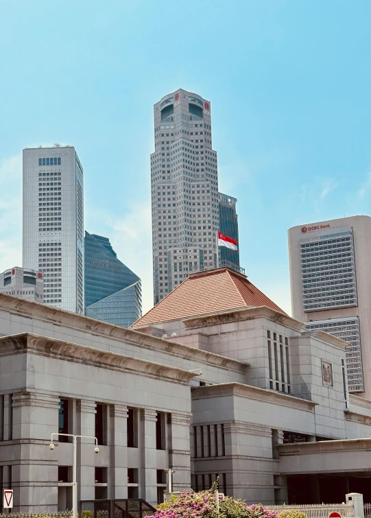 a city with tall buildings and a sign that reads national liry of indonesia