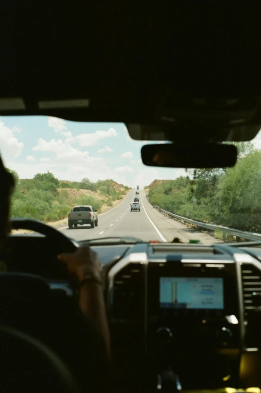 an image of the view from inside a car driving