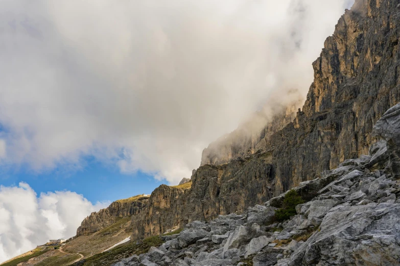 a mountain and a very tall steep rock hill