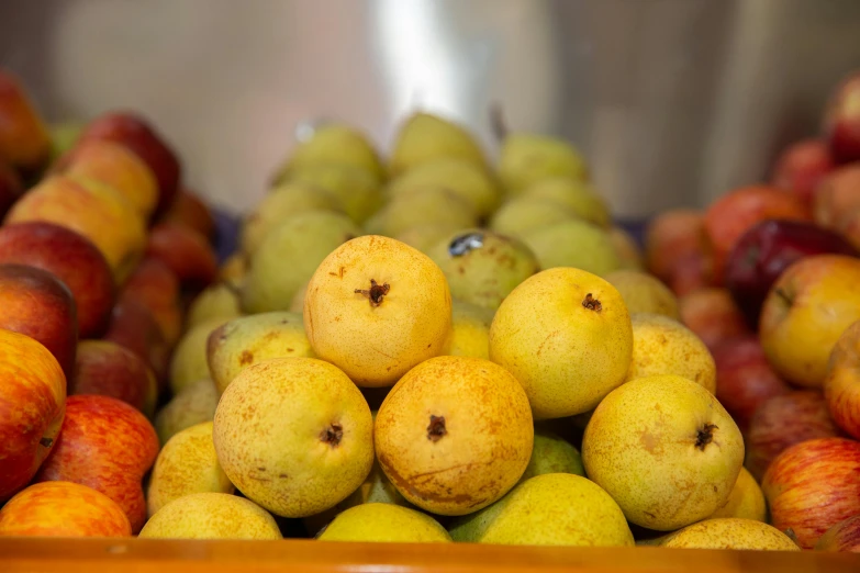 several pears that are sitting next to each other