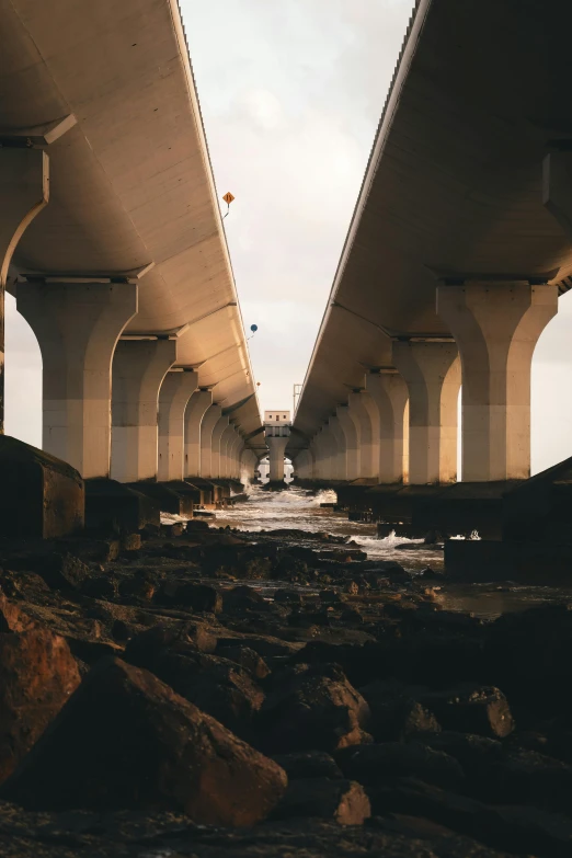 an image of the underside of two highway bridges