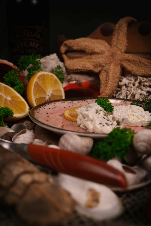 a plate of food with crab, carrots and bread