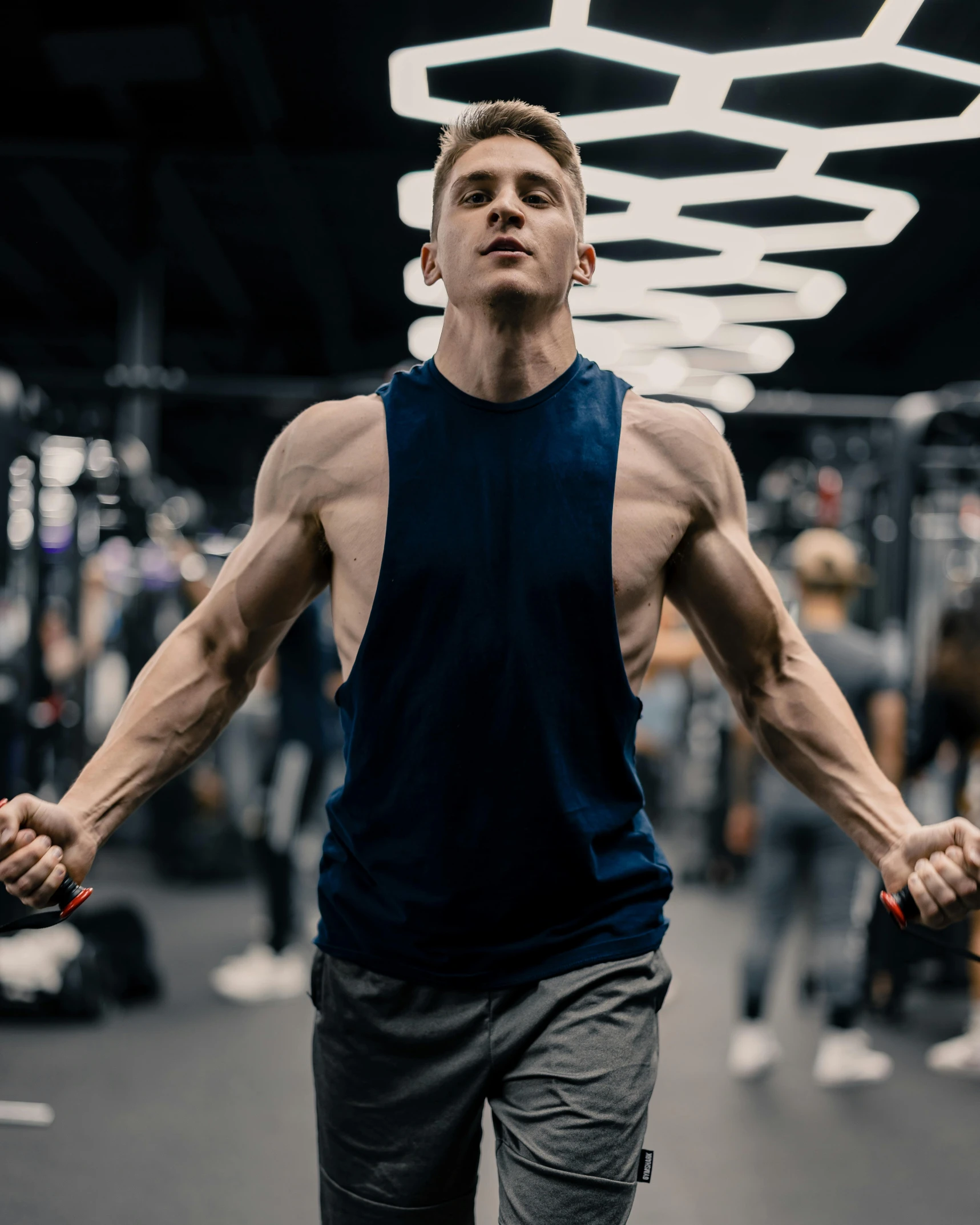 a man doing exercises on a weight machine in a gym