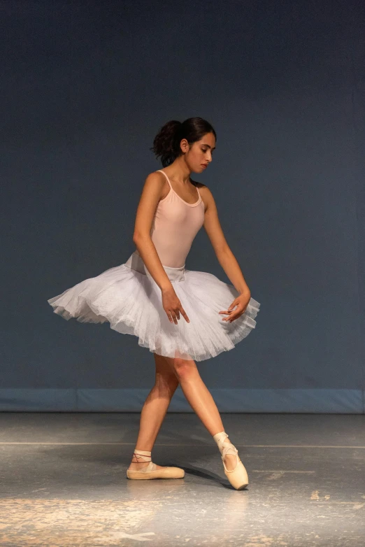 a woman is dancing in a dance studio