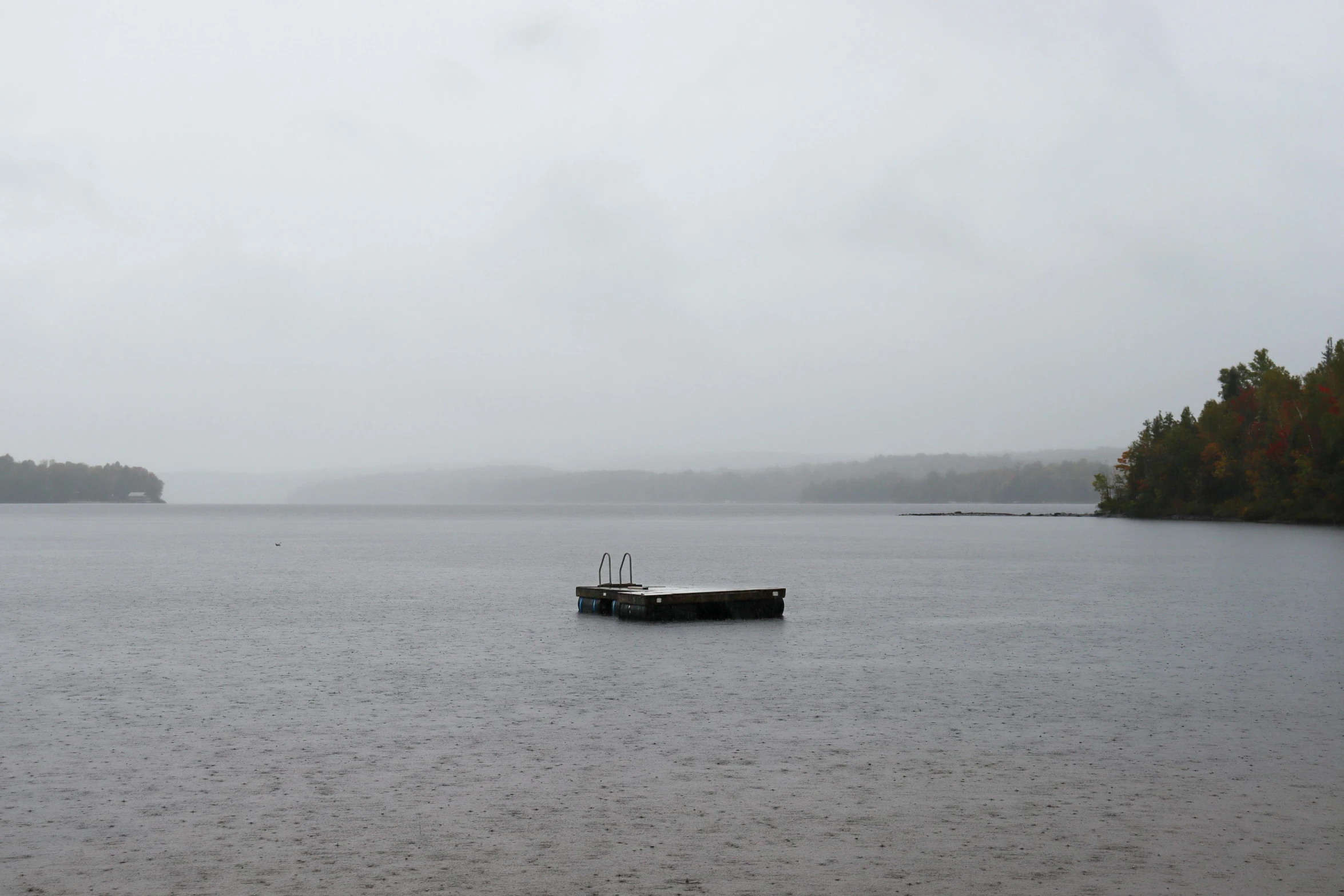 a boat that is sitting in the middle of a lake