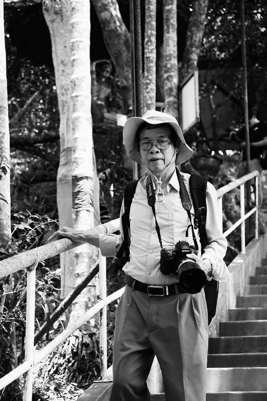 a person is wearing hat and walking down a flight of stairs