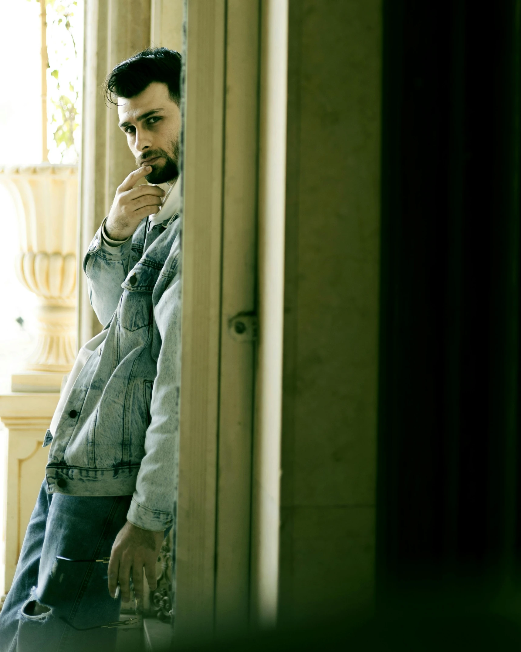 a man wearing jeans is taking a break from a meeting