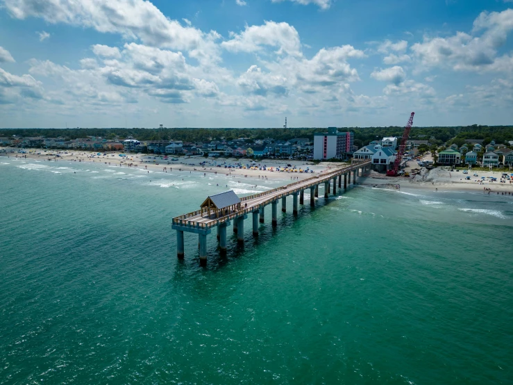 an aerial view of a pier over the ocean