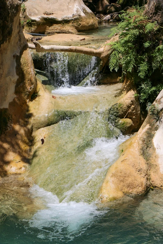 there is water flowing from a mountain stream